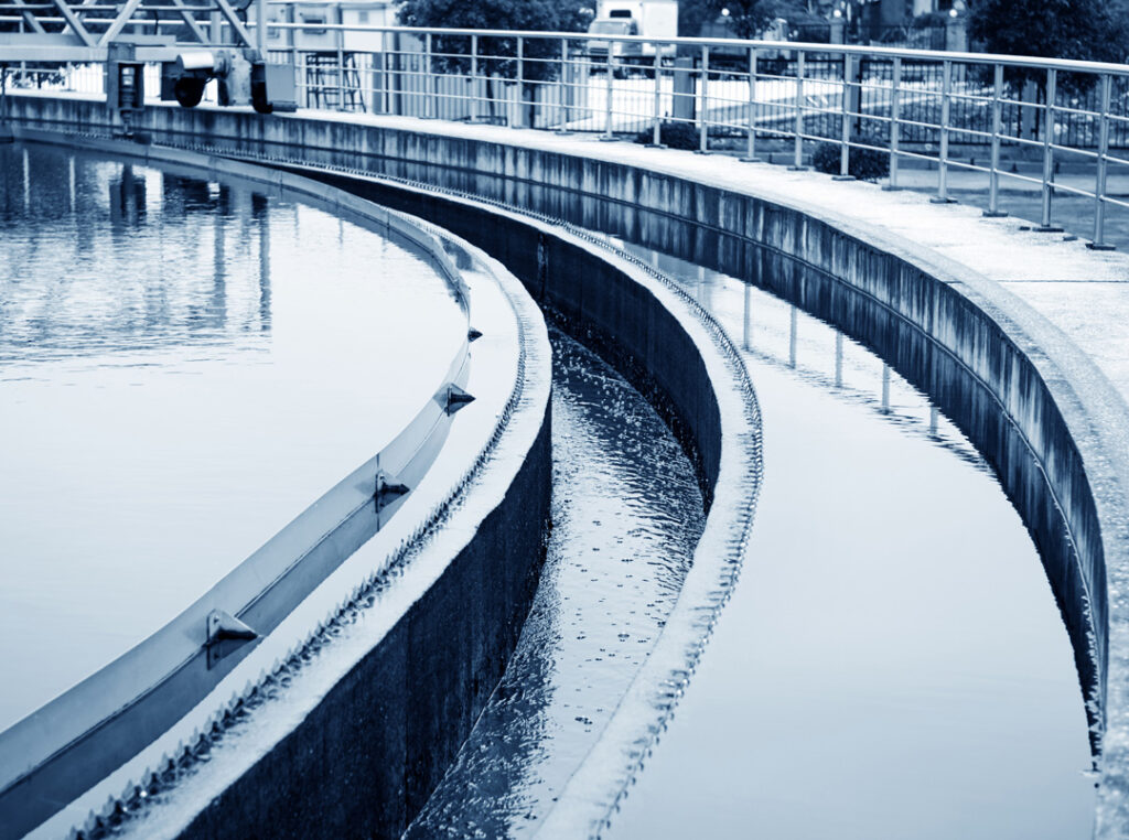 A water treatment facility, focusing on a clarifier basin.