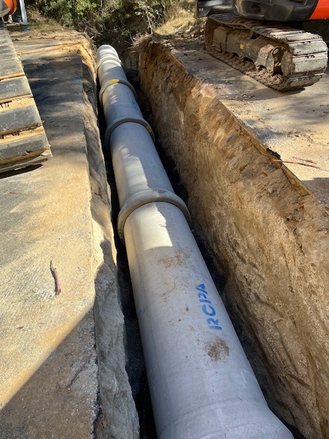 laying a new stormwater culvert line with reinforced concrete pipes (rcp) for the guthega rd repai