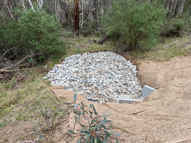 rock riprap energy dissipator and jute matting installed at a culvert outlet for the guthega rd dr