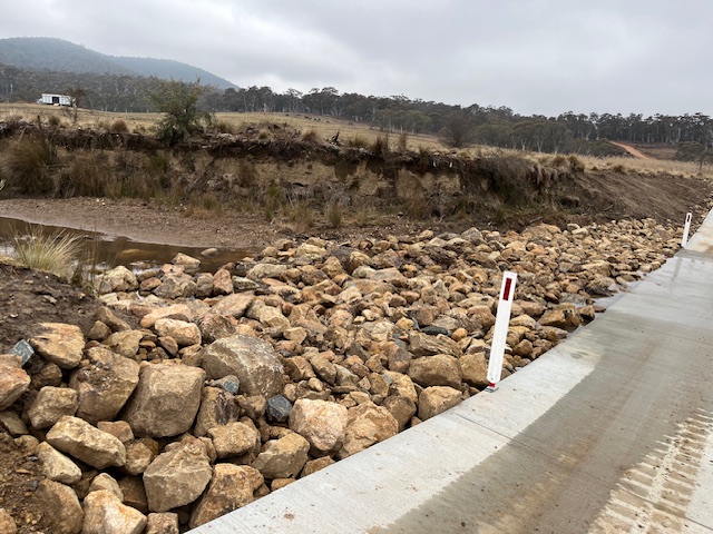rock riprap used for erosion control along the bank of the new springs crossing causeway