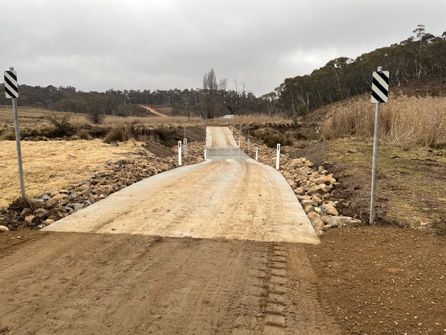 new concrete causeway at springs crossing with chevron alignment markers